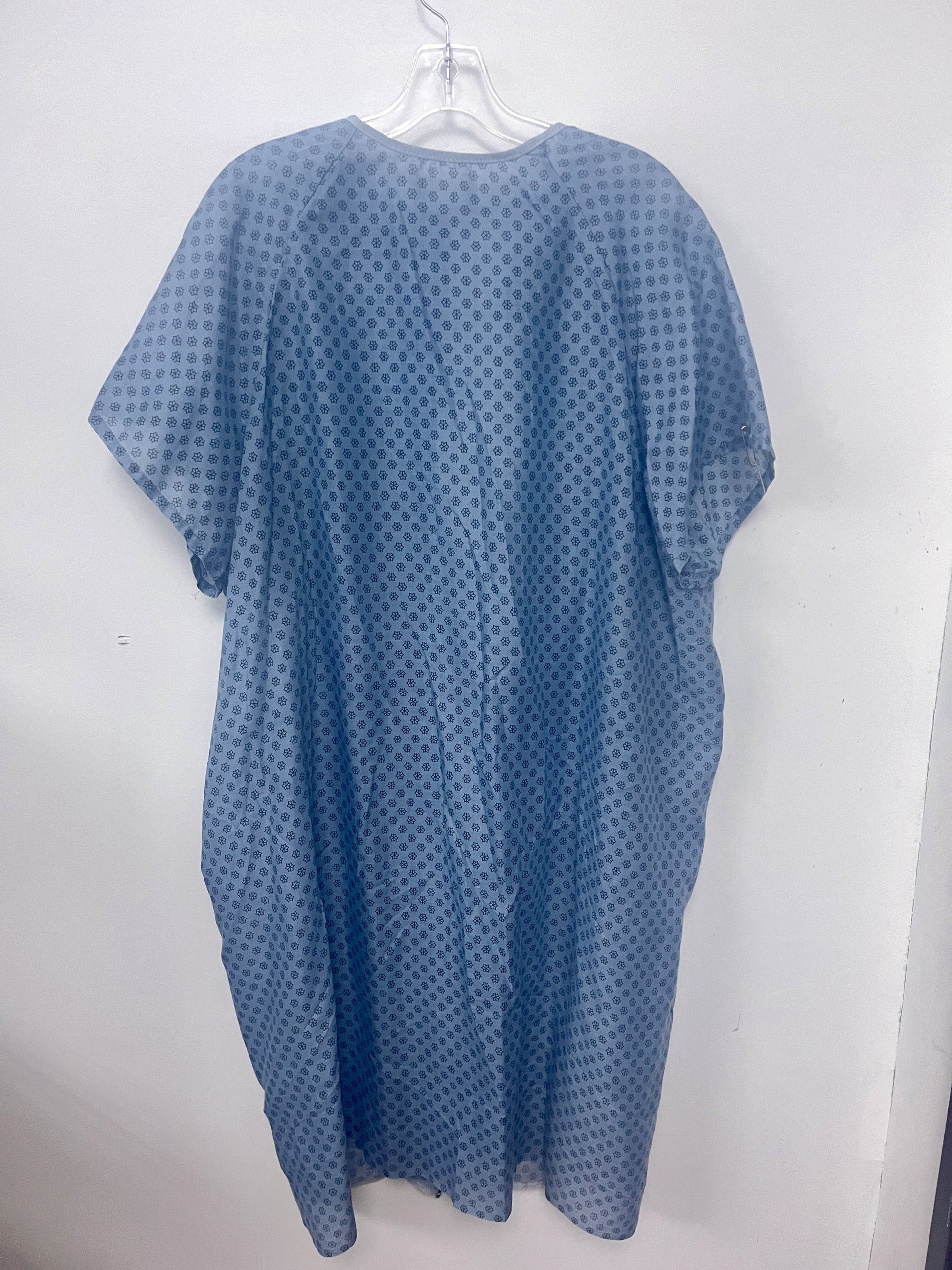 Blue patterned gown on a white hanger against a white background